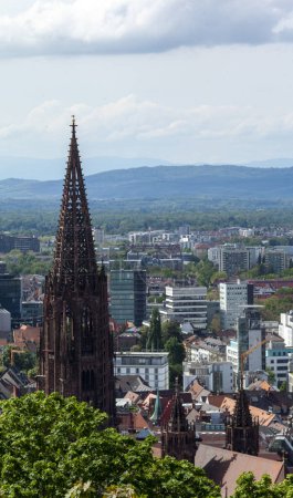 Photo for FREIBURG, GERMANY - MAY 6, 2023: View over Freiburg Minster from slope of Schlossberg Hill. The cathedral was founded around 1200 and completed in 1330 - Royalty Free Image