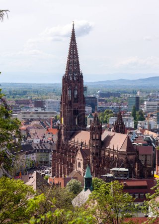 Photo for FREIBURG, GERMANY - MAY 6, 2023: View over Freiburg Minster from slope of Schlossberg Hill. The cathedral was founded around 1200 and completed in 1330 - Royalty Free Image