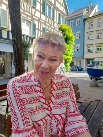 Portrait of a woman of mature age on the Ravensburg street, summer
