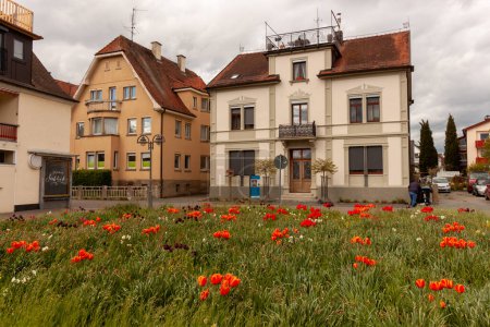 LANGENARGEN, GERMANY - APRIL 16, 2024: Picturesque old building and flowers in Langenargen near Bodensee