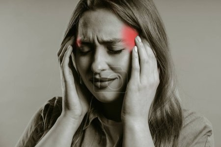 Photo for Portrait of beautiful suffering woman having headache, studio portrait. Girl putting hands on head. Concept of migraine problems, medicine, illness, magnetic storms concept - Royalty Free Image
