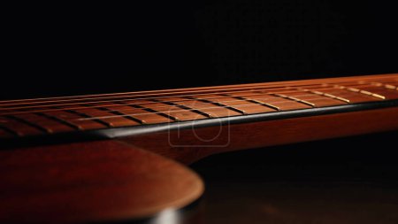 Photo for Macro of strings on redwood acoustic guitar fretboard. Classical music, sound background. High quality - Royalty Free Image