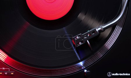 Photo for February 2024 - Prague, Czechia. Audio technica spinning, vinyl record grooves, playing music. Plate and needle stylus, loop song. High quality photo - Royalty Free Image
