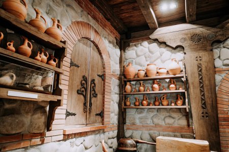 Photo for Traditional old wine cellar with handmade craft clay jugs. Antique winery concept. High quality photo - Royalty Free Image