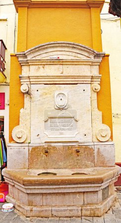 Photo for Parish church of Santa Mara and ornamental fountain in Cubellas, Tarragona, Catalunya, Spain, Europe - Royalty Free Image