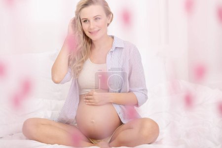 Photo for Cute Blond Pregnant Female on Third Trimester. With Pleasure Spending Time at Home. New Life Concept. Family Love. - Royalty Free Image