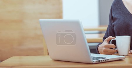 Photo for Working remotely. Woman at home on laptop undergoing online training or participating in online meeting. Modern technology. Home office. - Royalty Free Image