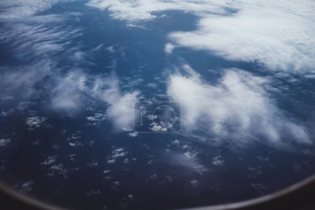 Photo for View from above down to clouds from a porthole. Sky and clouds background. - Royalty Free Image