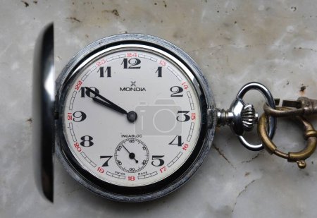 Photo for MILAN,ITALY - February 28 2024: Vintage mechanical pocket watch Mondia,isolated on white background. - Royalty Free Image
