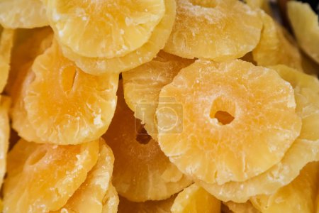 Photo for A pile of candied pineapple slices for sale at a market in Nice, France - Royalty Free Image