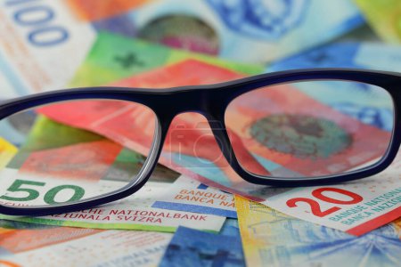 Photo for There are glasses on several Swiss franc banknotes. This theme can be used to illustrate a wide range of financial topics. - Royalty Free Image