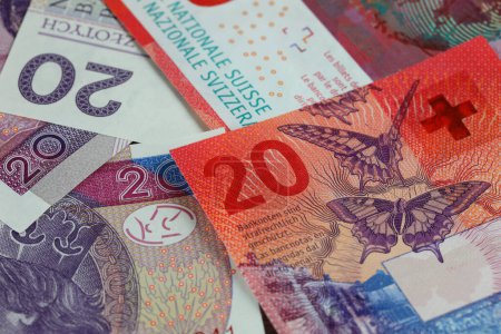 Photo for Polish and Swiss money. Swiss banknotes next to Polish Zloty banknotes. This theme can be used to illustrate many different financial topics. PLN and CHF currencies - Royalty Free Image