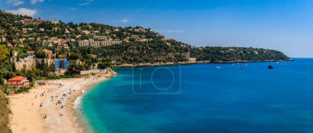 Photo for Panoramic view onto Roquebrune Cap Martin peninsula and beach near Monaco with the turquoise water of the Mediterranean Sea, South of France - Royalty Free Image