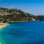 Panoramic view onto Roquebrune Cap Martin peninsula and beach near Monaco with the turquoise water of the Mediterranean Sea, South of France