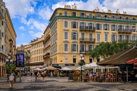 Photo for Nice, France - May 29, 2022: Restaurants and bars on a busy square in the Old Town, Vieille Ville, French Riviera - Royalty Free Image