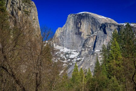 Scenic view of the famous Half Dome granite rock formation in the Yosemite National Park, Sierra Nevada mountain range in California, USA