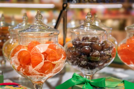Photo for Whole candied glazed clementine citrus fruit on display at a confectionery store in the medieval Saint Paul de Vence, French Riviera, South of France - Royalty Free Image