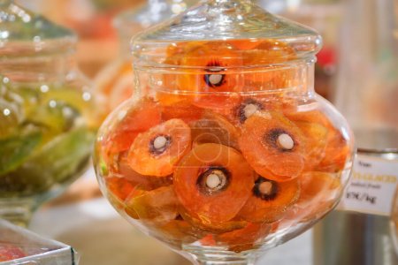 Photo for Whole candied glazed clementine citrus fruit on display at a confectionery store in the medieval Saint Paul de Vence, French Riviera, South of France - Royalty Free Image