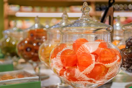 Photo for Whole candied clementine citrus fruit on display at a confectionery store in the medieval town of Saint Paul de Vence, French Riviera, South of France - Royalty Free Image