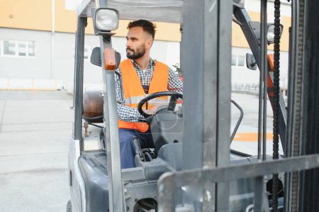 Photo for Friendly forklift driver at work. - Royalty Free Image