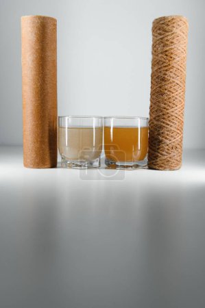 Photo for Used water filters, glasses with dirty water. - Royalty Free Image