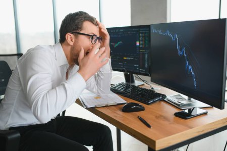 Photo for Stressed business man crypto trader broker investor analyzing stock exchange market crypto trading decreasing chart data fall down loss, desperate about losing money of crisis, recession, inflation - Royalty Free Image