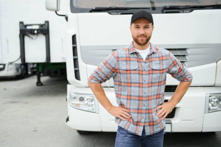 Photo for Portrait of young Caucasian bearded trucker standing by his truck vehicle. Transportation service. Truck driver job - Royalty Free Image