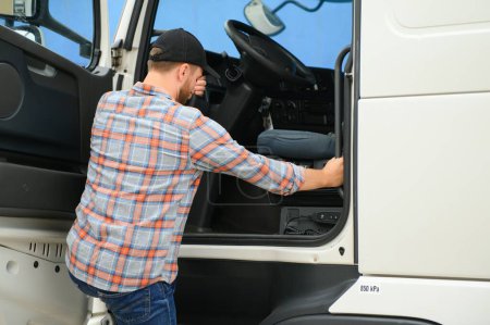 Caucasian Male Truck Driver Stepping Out Of Vehicle At Rest Stop