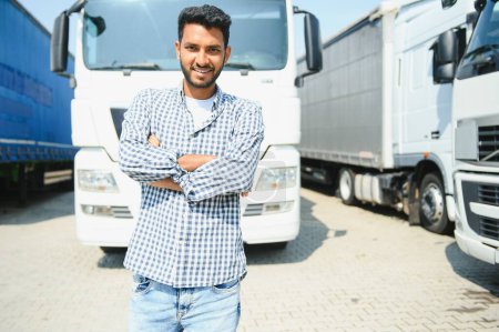 Photo for Young Indian truck driver. Concept of road freight transportation - Royalty Free Image