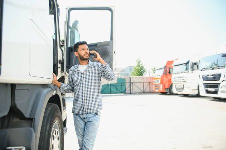 Photo for Young Indian truck driver. Concept of road freight transportation - Royalty Free Image