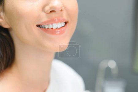 Photo for Stomatology concept, partial portrait of girl with strong white teeth. Closeup of young woman at dentist's, studio, indoors. - Royalty Free Image
