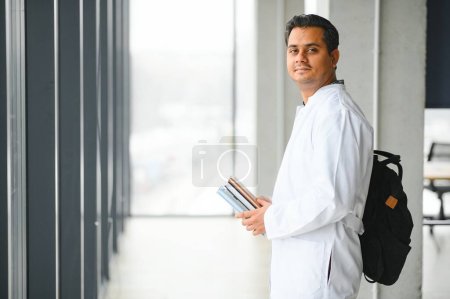 Photo for Portrait of a handsome Indian medical student. The concept of higher education - Royalty Free Image