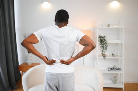 Photo for Young African Man Having Back Pain. - Royalty Free Image