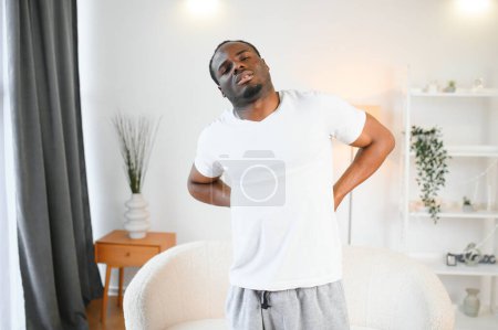 Photo for Young African Man Having Back Pain. - Royalty Free Image