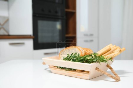 Photo for Craft wooden plate for storing bread or vegetables in the kitchen. - Royalty Free Image