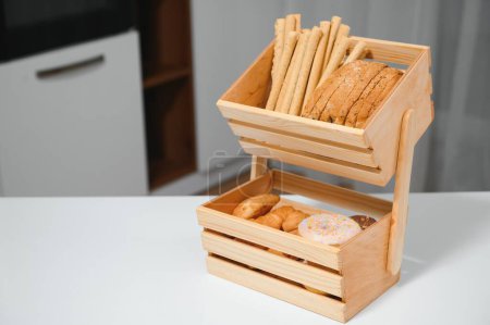 Photo for Craft wooden plate for storing bread or vegetables in the kitchen. - Royalty Free Image