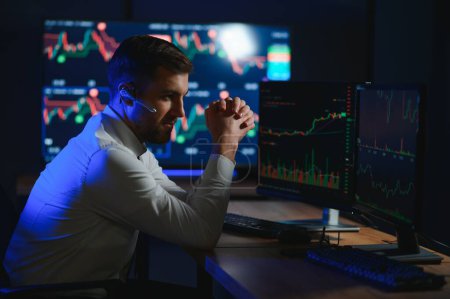 Financial Analysts and Day Traders Working on a Computers with Multi-Monitor.