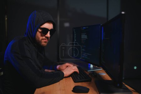 Photo for Hacker is hacking into the computer network. Computer criminal. - Royalty Free Image