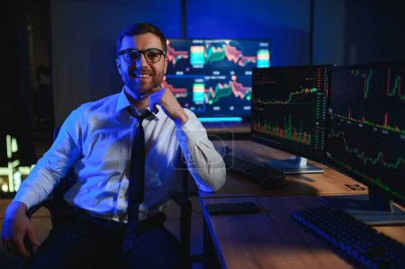 Financial Analysts and Day Traders Working on a Computers with Multi-Monitor.