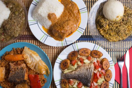 Téléchargez les photos : Traditional African dishes assortment on a restaurant table, top wiev. - en image libre de droit