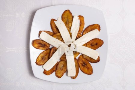 Foto de Ripe Plantains with Cheese on a white plate - Imagen libre de derechos