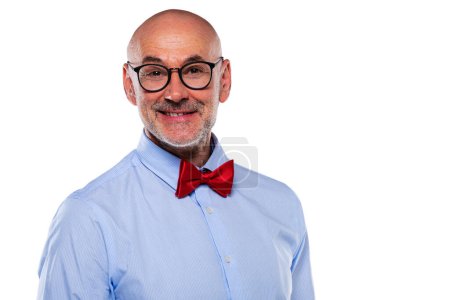 Téléchargez les photos : Close-up of mid aged man wearing glasses and bow tie and standing at isolated white background. Copy space. - en image libre de droit