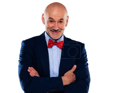 Téléchargez les photos : Studio portrait of mid aged man wearing bow tie and blazer while standing at isolated white background. Copy space. - en image libre de droit