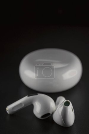 Photo for ROSTOV-ON-DON, RUSSIA - APRIL 28, 2018: Apple AirPods wireless Bluetooth headphones and charging case for Apple iPhone. New Apple Earpods Airpods in box. - Royalty Free Image