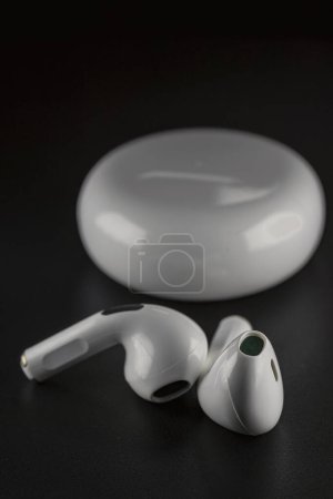 Photo for ROSTOV-ON-DON, RUSSIA - APRIL 28, 2018: Apple AirPods wireless Bluetooth headphones and charging case for Apple iPhone. New Apple Earpods Airpods in box. - Royalty Free Image