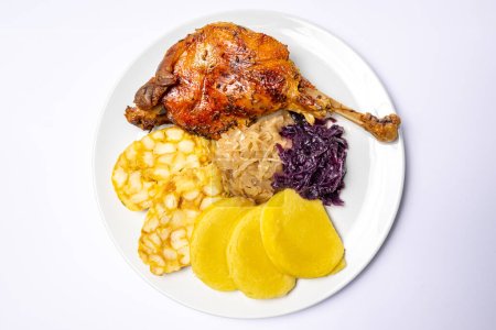 Roast duck, goose with dumplings and cabbage