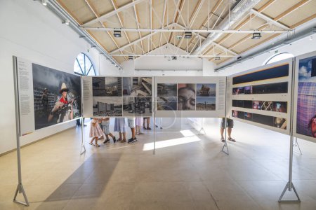 Photo for PORTIMAO, PORTUGAL - 29th JULY 2023: World Press Photo exhibition event depicting important journalism photography and documentary works in the old fish market building. Entry is free for everyone. - Royalty Free Image