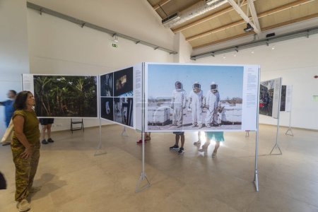 Photo for PORTIMAO, PORTUGAL - 29th JULY 2023: World Press Photo exhibition event depicting important journalism photography and documentary works in the old fish market building. Entry is free for everyone. - Royalty Free Image