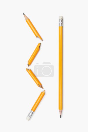 Broken and whole pencil on a white vertical background. Two yellow graphite pencils broken into many parts and whole close-up. Emotions, stress, anger, problems. Pause concept
