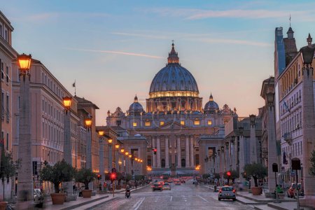 Sunset over St. Peter's Basilica in the Vatican. Evening at the most famous landmark, cloudy sky.